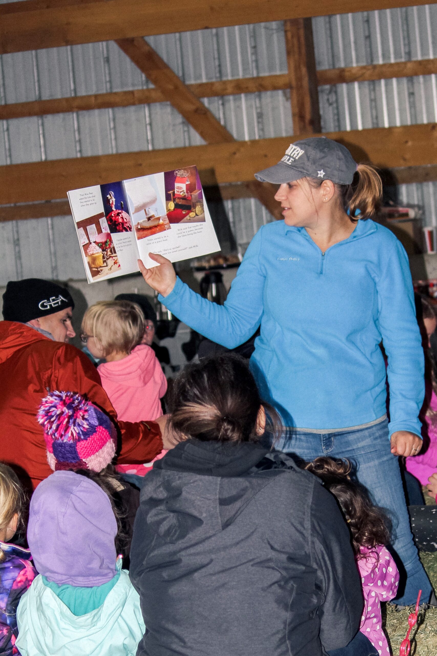 Angie Tauer reads to farm families.