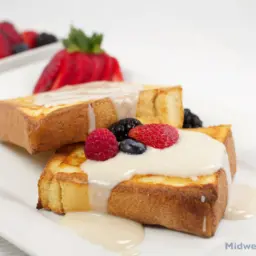 Baked French toast with maple yogurt and fruit.