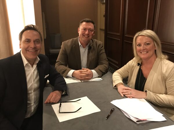 Former Midwest Dairy CEO Lucas Lentsch sits at a table with Beth Engelmann, chief marketing communications officer at Dairy Management, Inc. and Victor Zaborsky, vice president of marketing at MilkPEP.