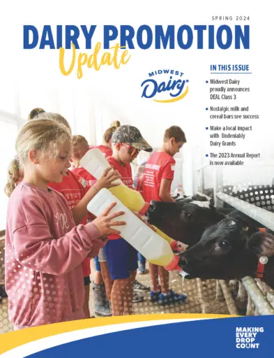 Dairy Promotion update magazine front cover. Girl feeding calf a bottle.