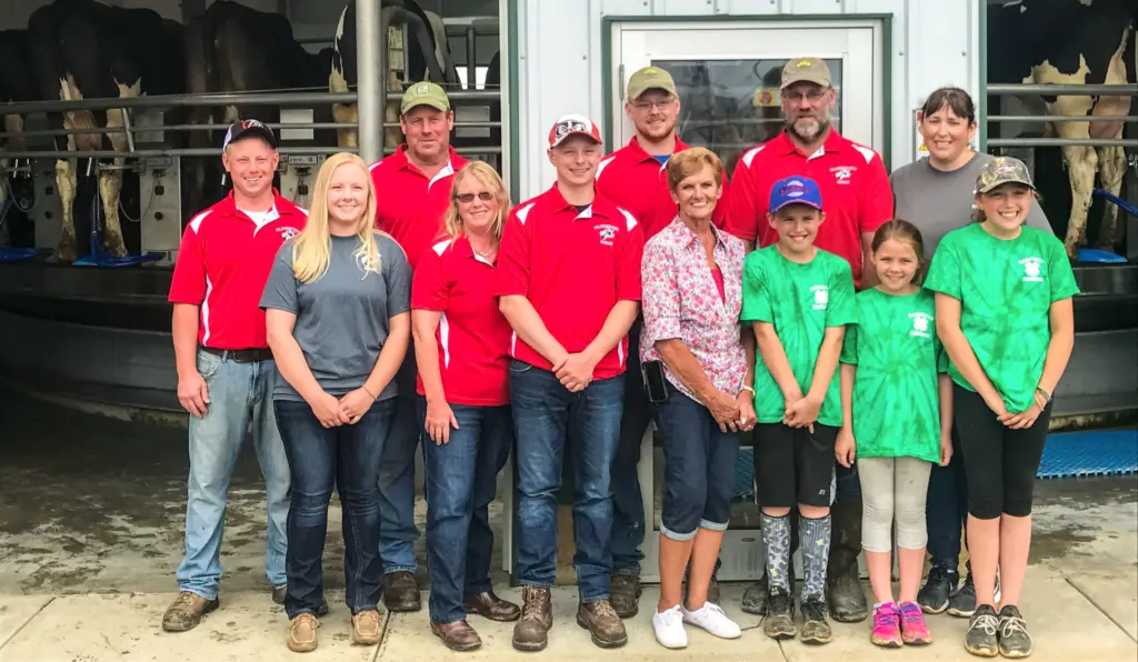 The Hildebrandt family poses in front of their barn.