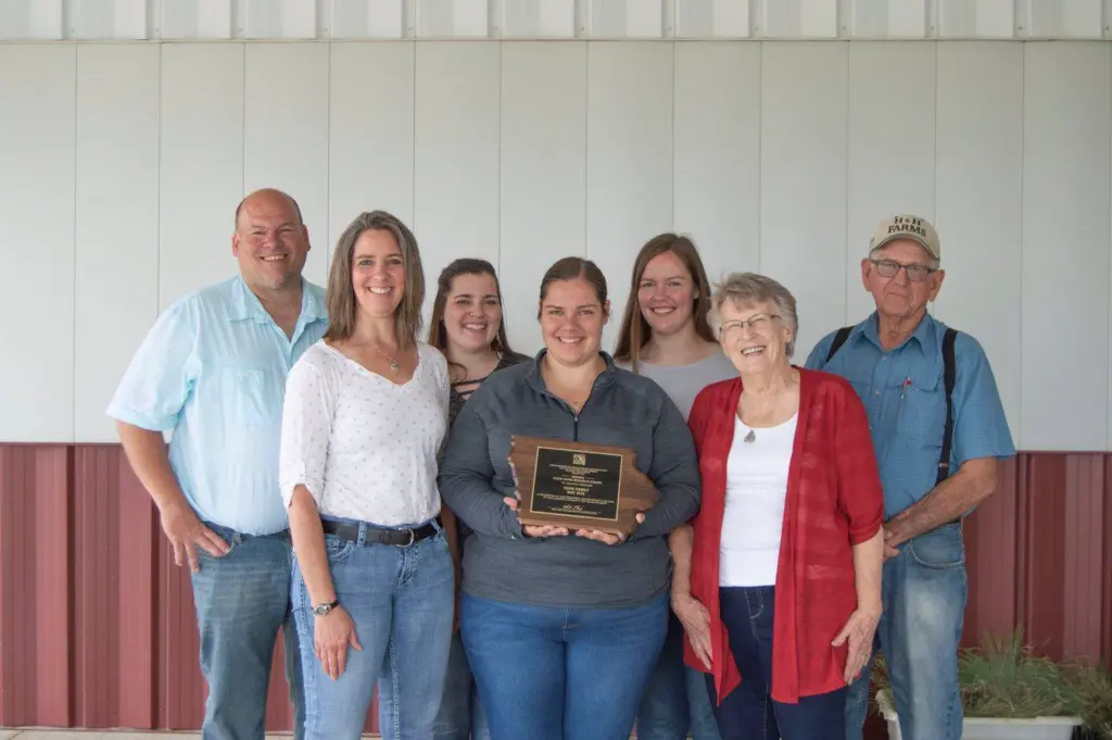 Huhe family from Iowa holding Wergin Award