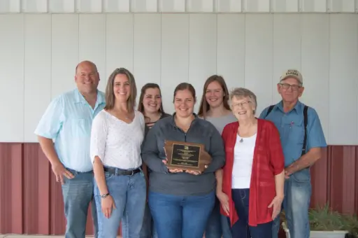 Huhe family from Iowa holding Wergin Award