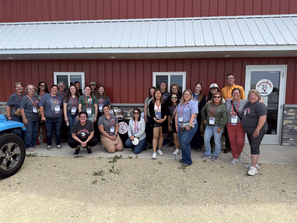Group of educators smiling at camera.