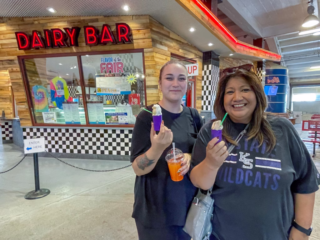 Two women eating ice cream at the Kansas State Fair