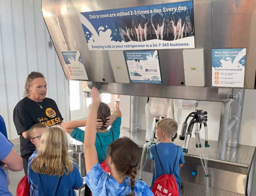 Dairy farmer teaching fairgoers at Nebraska State Fair