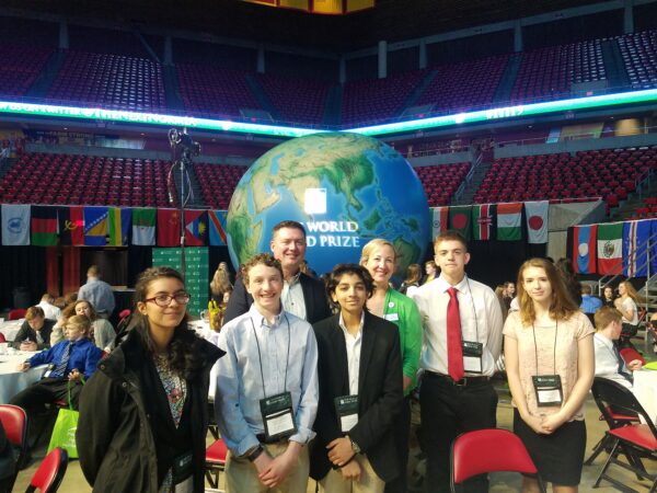 Former Midwest Dairy CEO Lucas Lentsch and a group of teens at the World Food Prize conference in Iowa.
