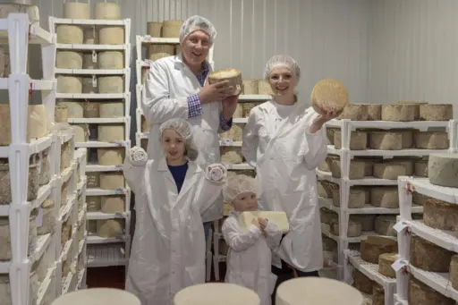 Sjostrom Family holding cheese