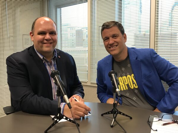Andy Vance and Jeff Fromme sit at a table, ready to record a podcast.