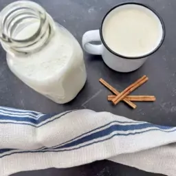 Cup of milk with glass jar