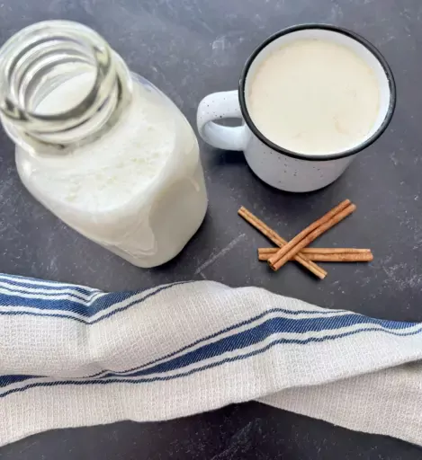 Cup of milk with glass jar