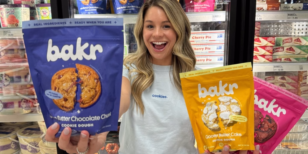 Woman holding up bags of Bakr cookies