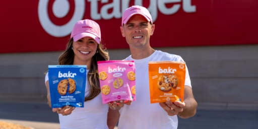 Alexa Ryan and husband in front of Target holding Bakr Cookie bags