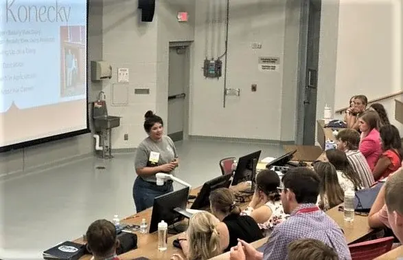 Dairy farmer presenting to students