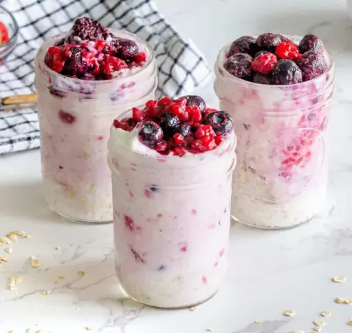 Image of berry overnight oats in a jar.
