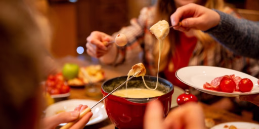 People eating cheese fondue