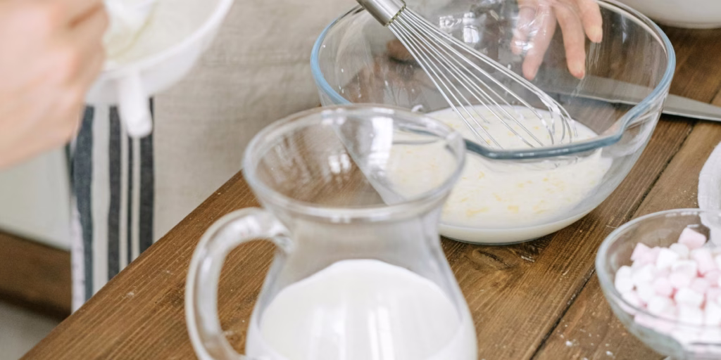 Milk being whisked into recipe