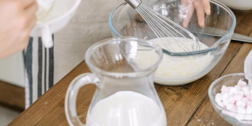 Milk being whisked into recipe