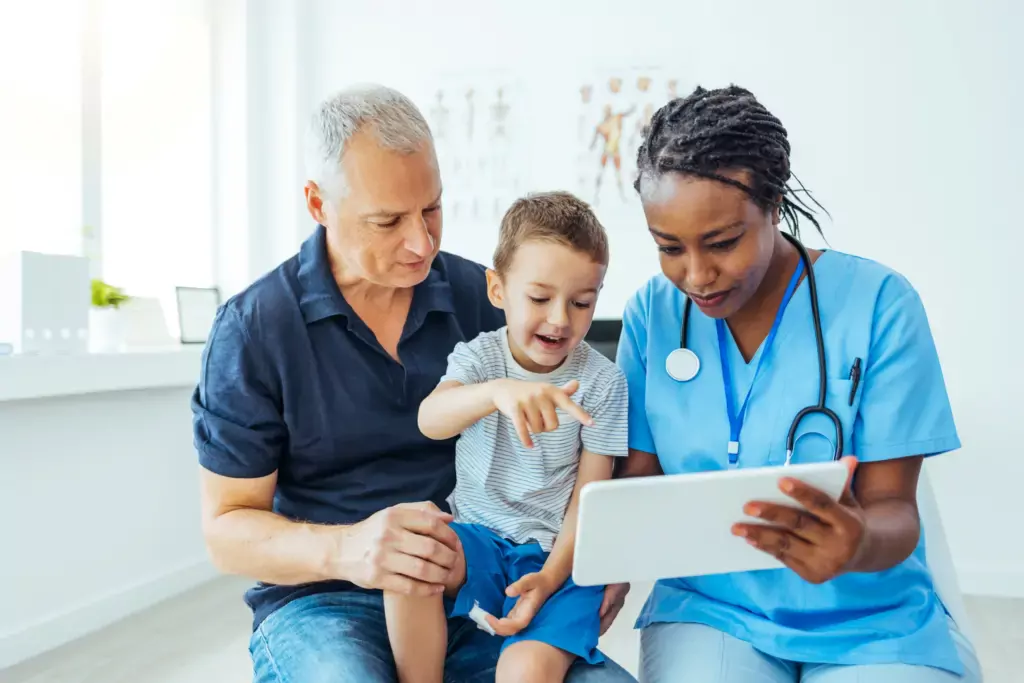 Doctor Showing to Father Medical Results on Tablet