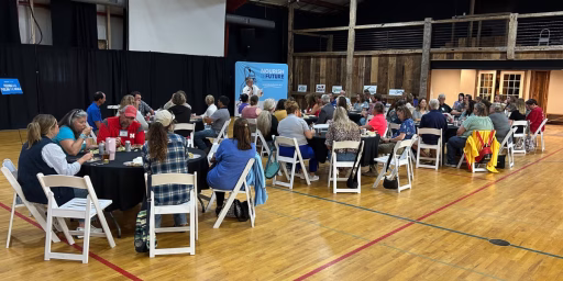 Attendees at Nourish the Future event listening to speaker