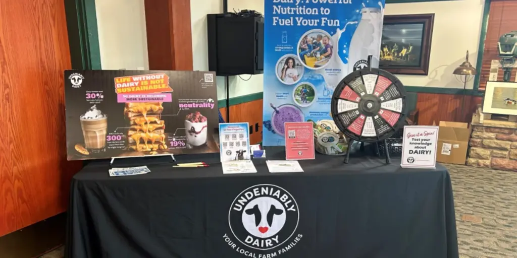 Dairy booth at environmental conference.