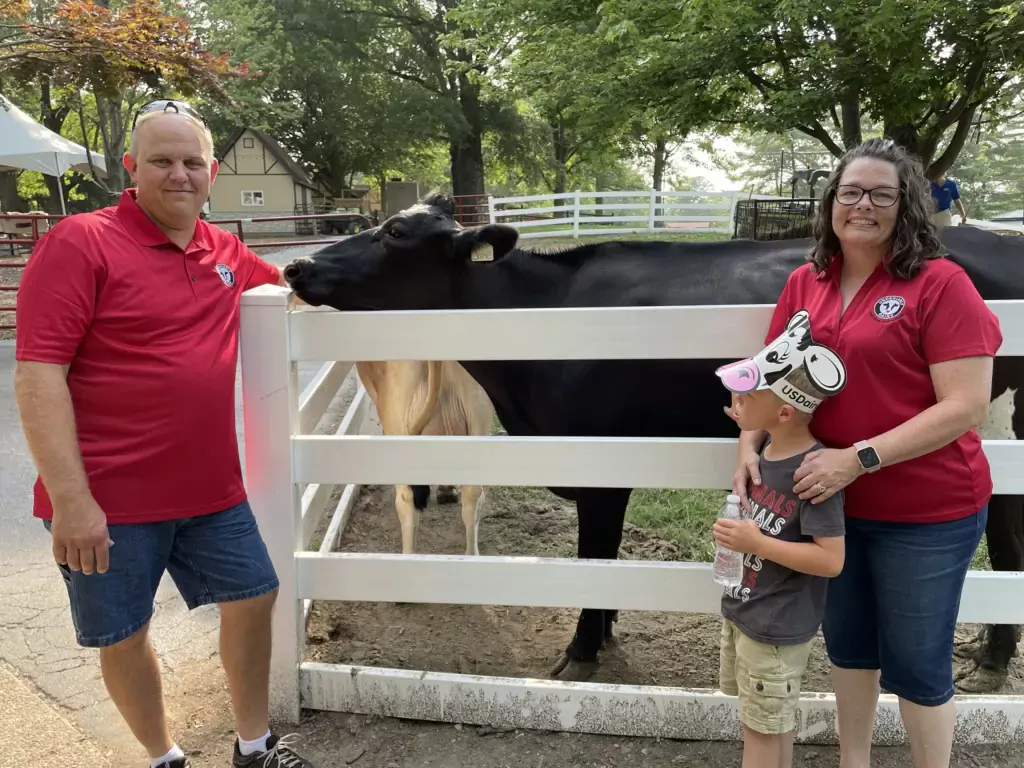 Dairy farmers Mark, Johna, and Hudson Fellwock at Grant's Farm.