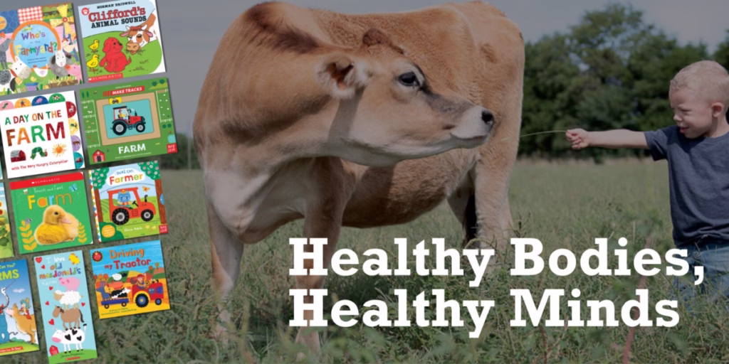 Image of boy feeding dairy cow