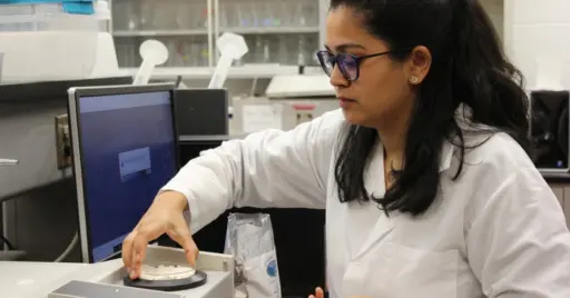 Women in lab coat researching dairy