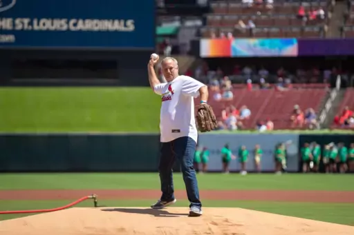 Dairy farmer throwing first pitch