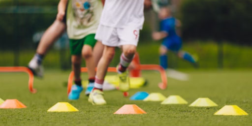 Children running through turf games