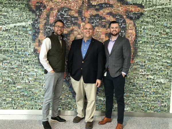 Dairy on the Air host Andy Vance poses with Chicago Bears Corporate Partnerships Manager Matt Black and Chicago Bears Partnership Activation Specialist Kevin Anderson.