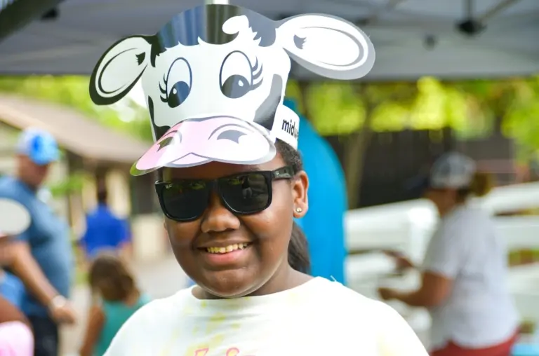 African American girl wearing a cow hat.