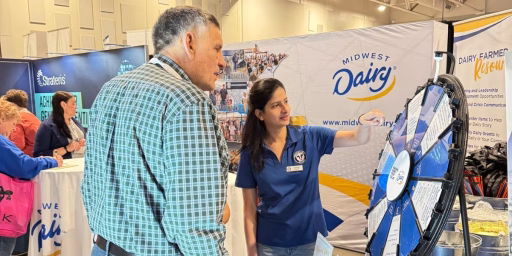 South Dakota Dairy Ambassador with dairy farmer at event