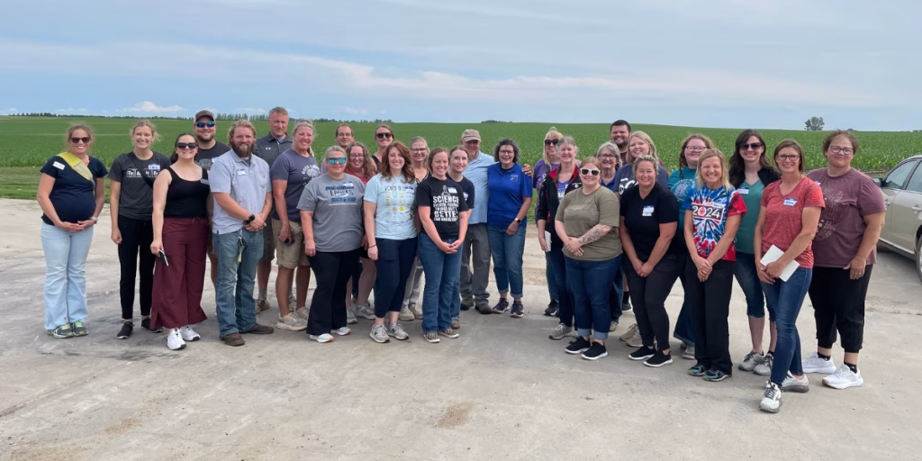 Group of teachers on dairy farm tour.