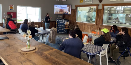 Group of educators listening to farmer presentation