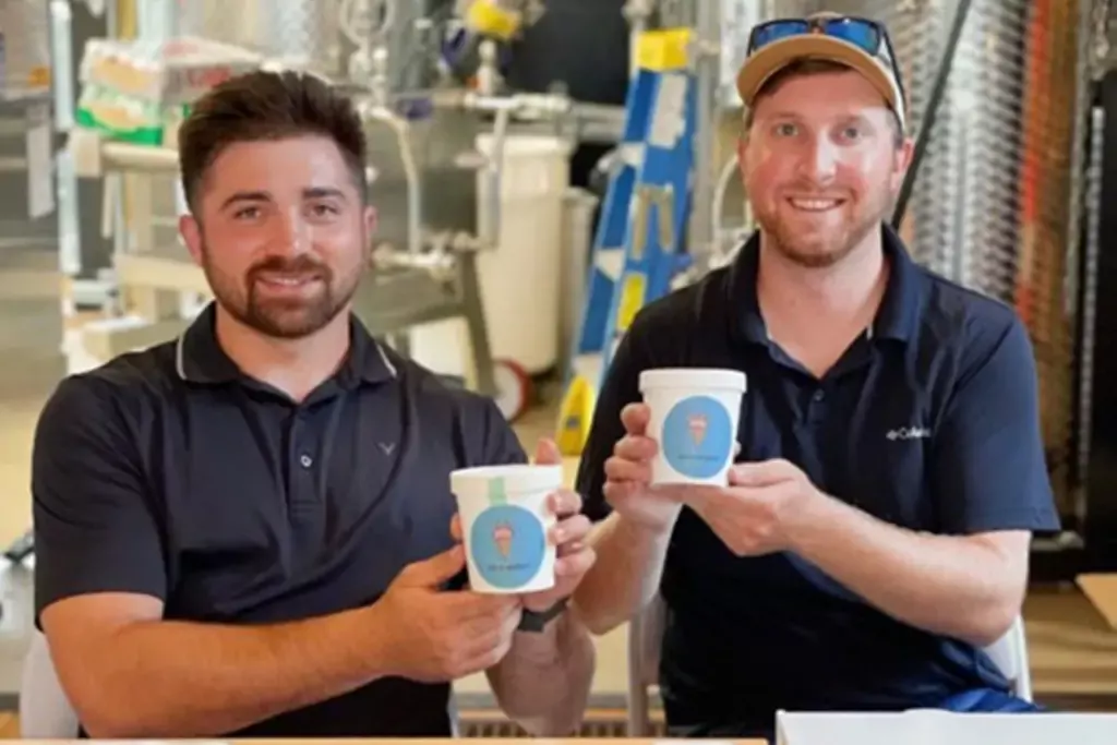 Two men holding ice cream pints